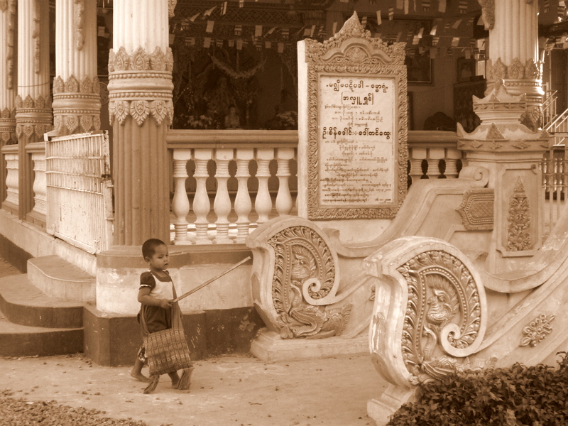 little girl outside of a Mandalay temple