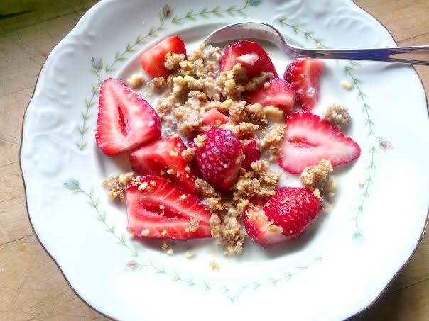 Crumbled LARABAR with strawberries and almond milk